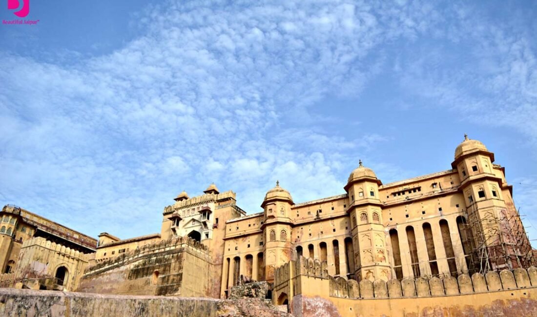 Wide exterior view of Amer Fort Jaipur under a blue sky