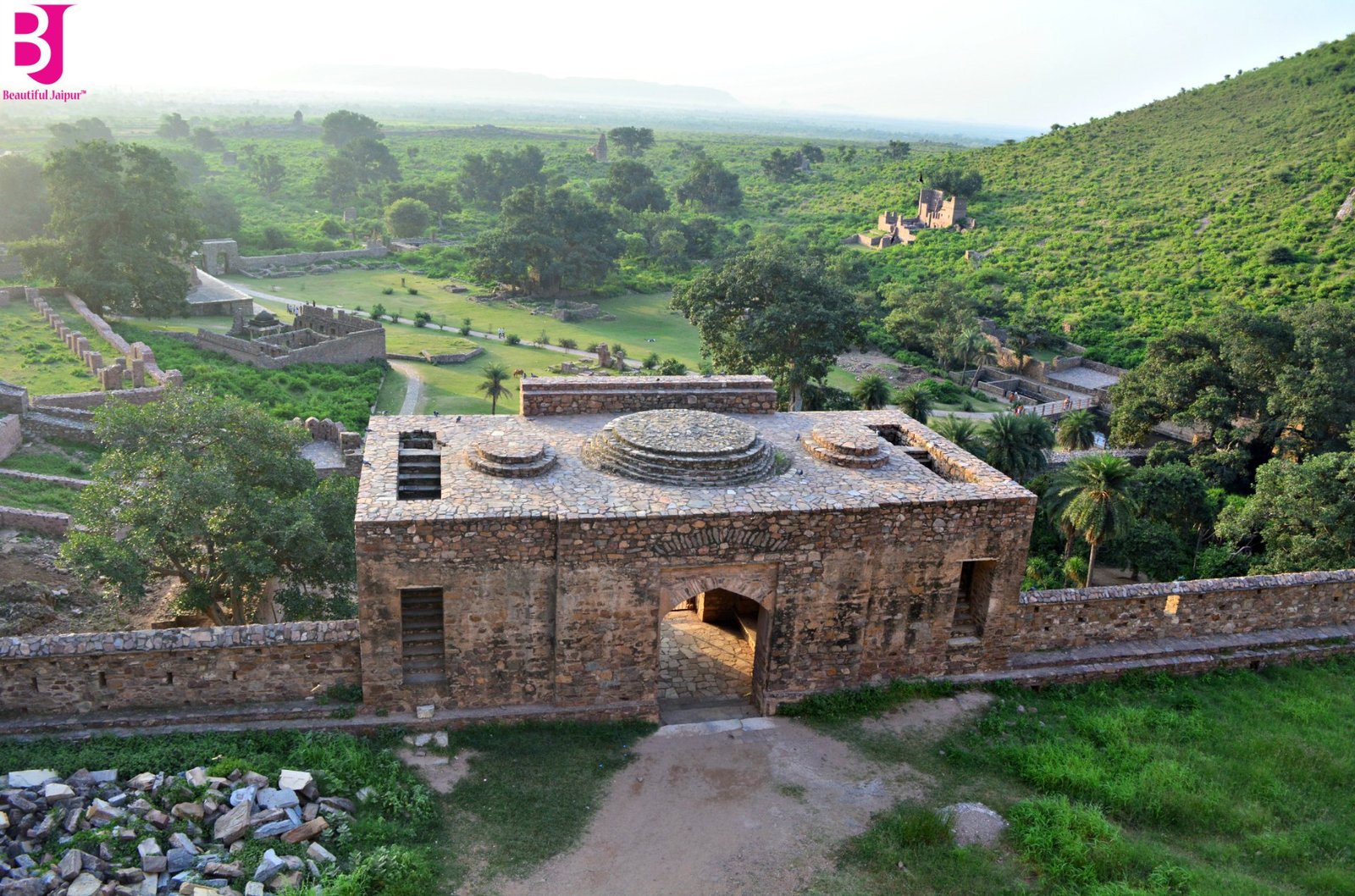 Elevated view of Bhangarh Fort ruins surrounded by the Aravalli hills