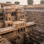 Wide view of Chand Baori Abhaneri showing its historic pavilion and symmetrical steps