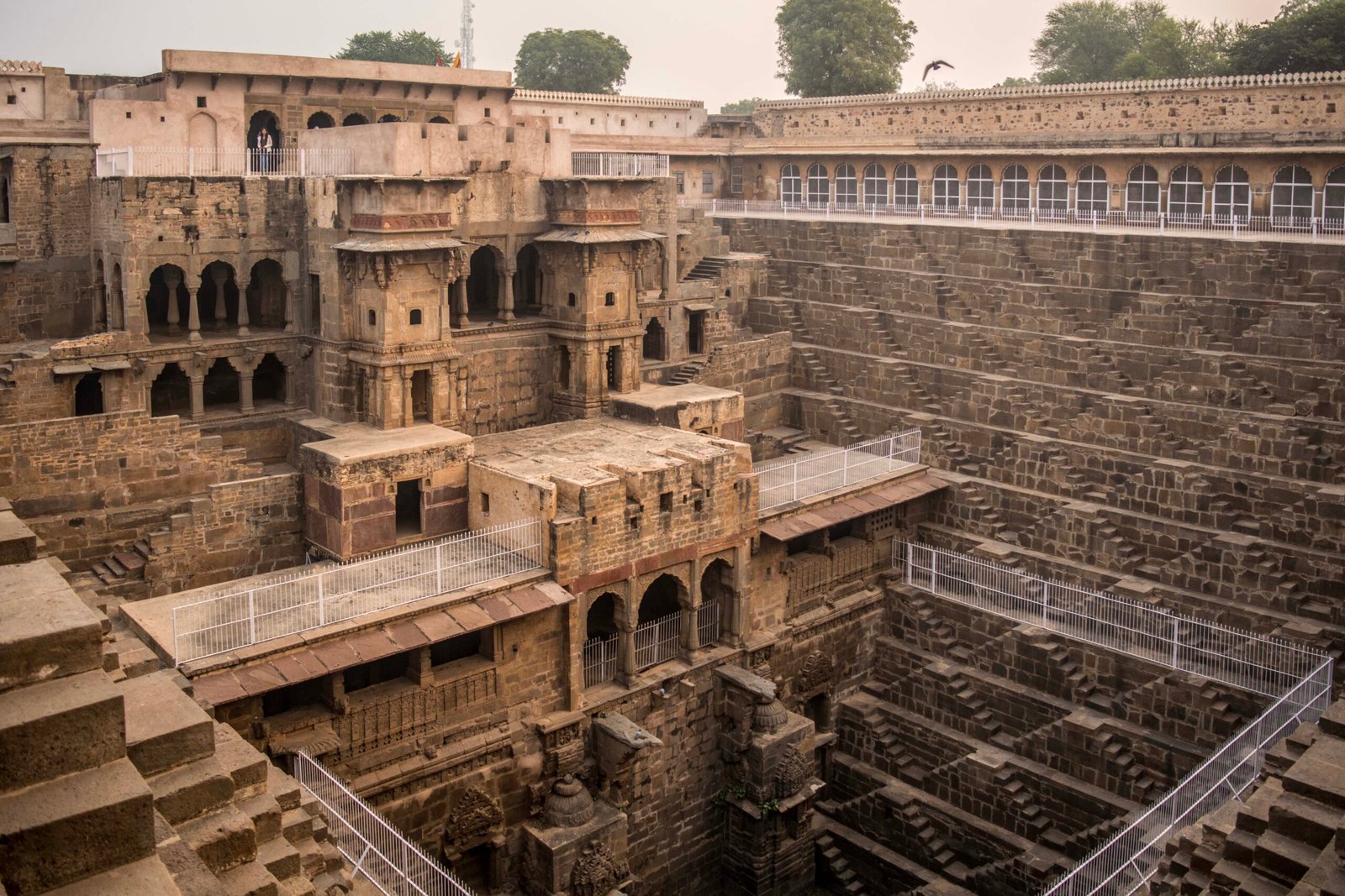 Wide view of Chand Baori Abhaneri showing its historic pavilion and symmetrical steps