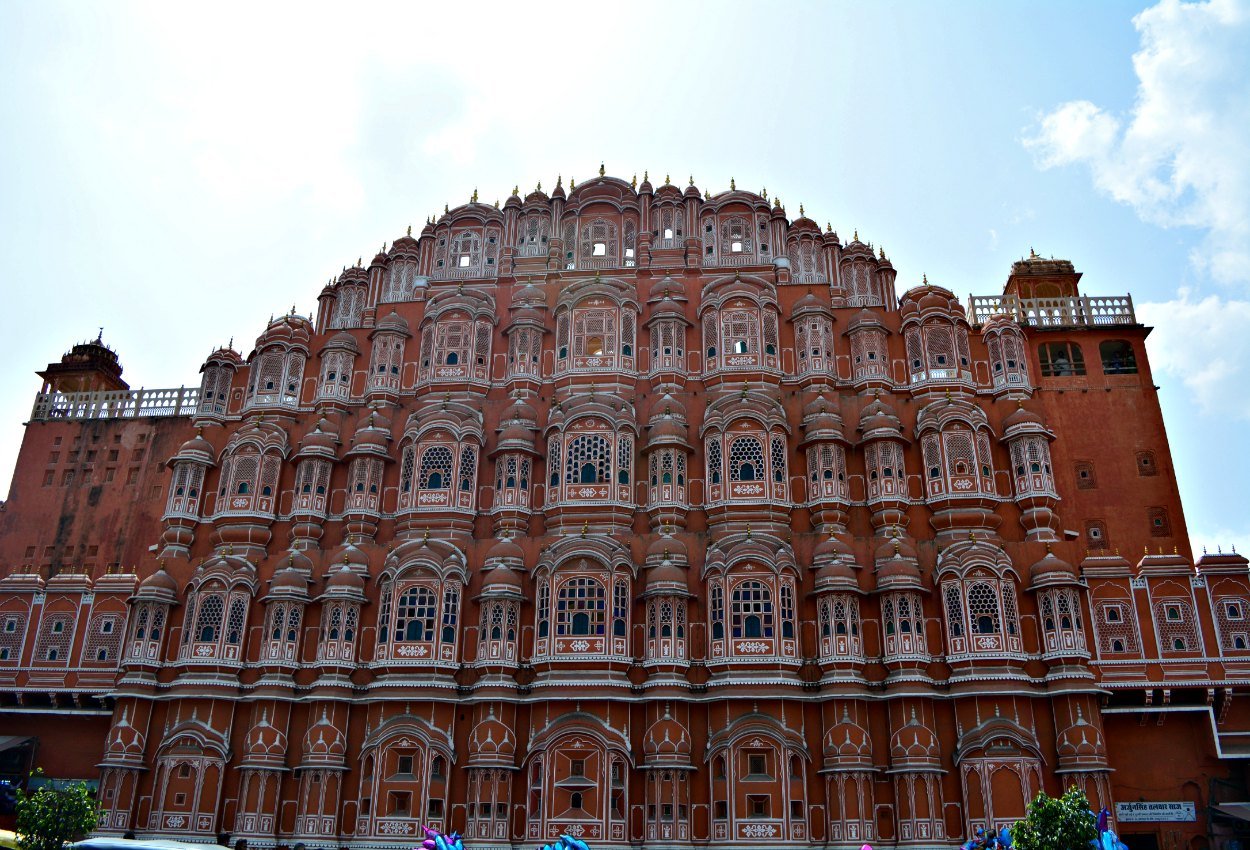 Iconic front facade of Hawa Mahal Jaipur with its pink jharokhas