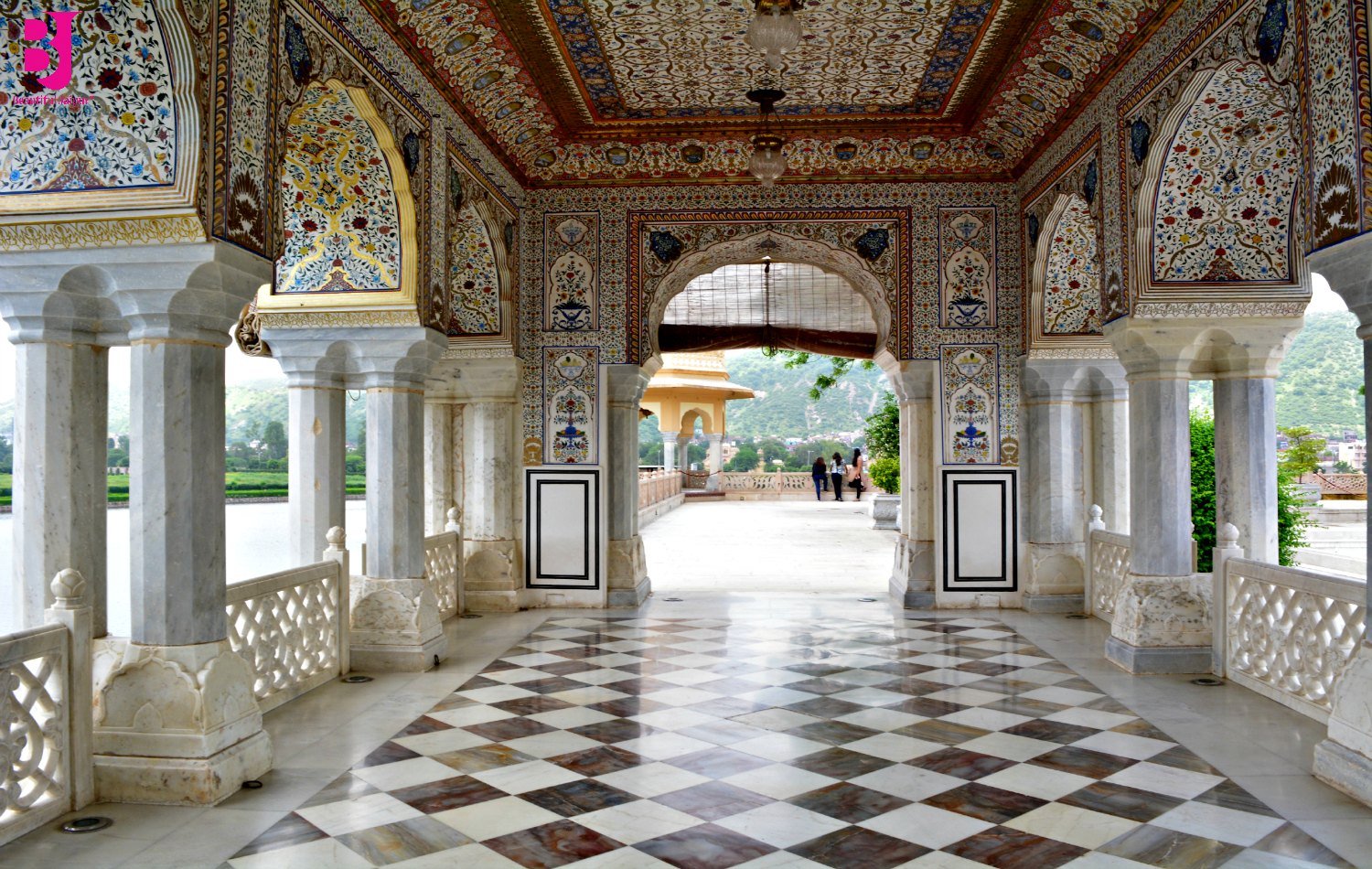 Decorated arches and marble corridor inside Jal Mahal Jaipur