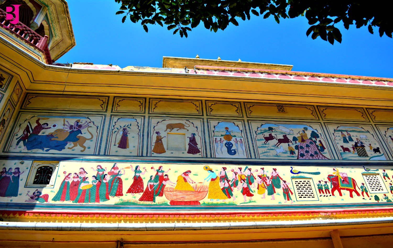 Radha Krishna murals painted on Sisodia Rani Garden palace walls
