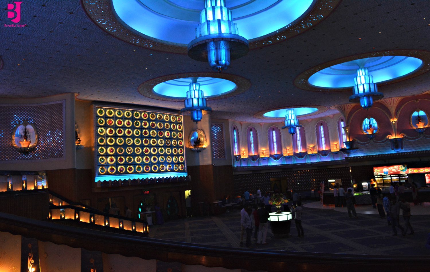 Grand interior lobby and blue chandeliers inside Raj Mandir Cinema Jaipur