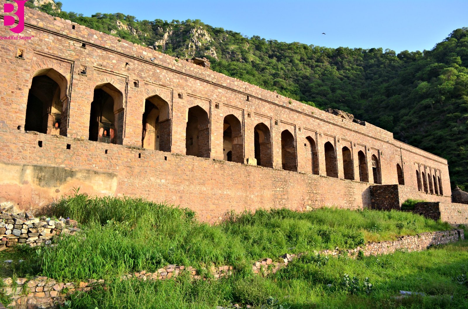 Long arched building among the royal ruins inside Bhangarh Fort