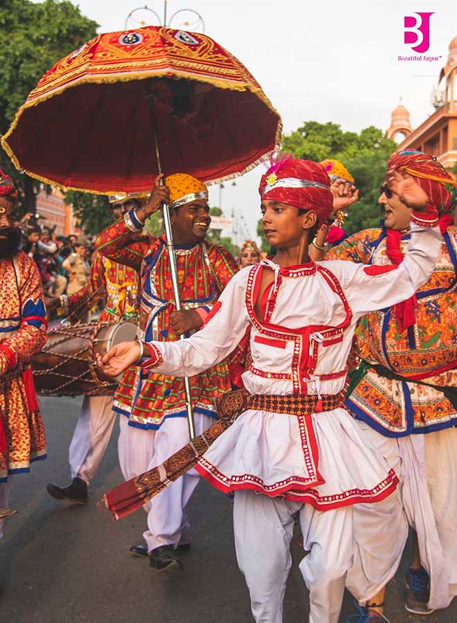 Rajasthani folk artists in traditional dress at Jaipur Teej Festival